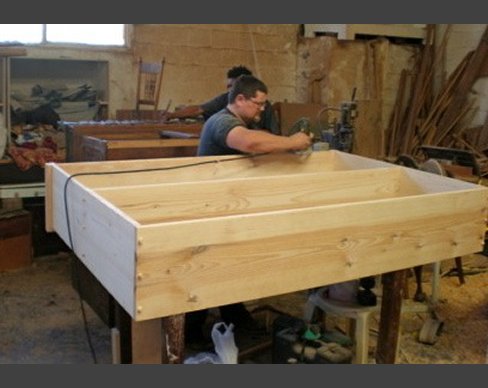 Pine furniture is made to customer requirements for several retail shops. Pine furniture