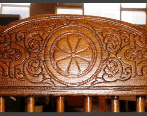 Back of chair repaired and carved to match original. Chair back detail